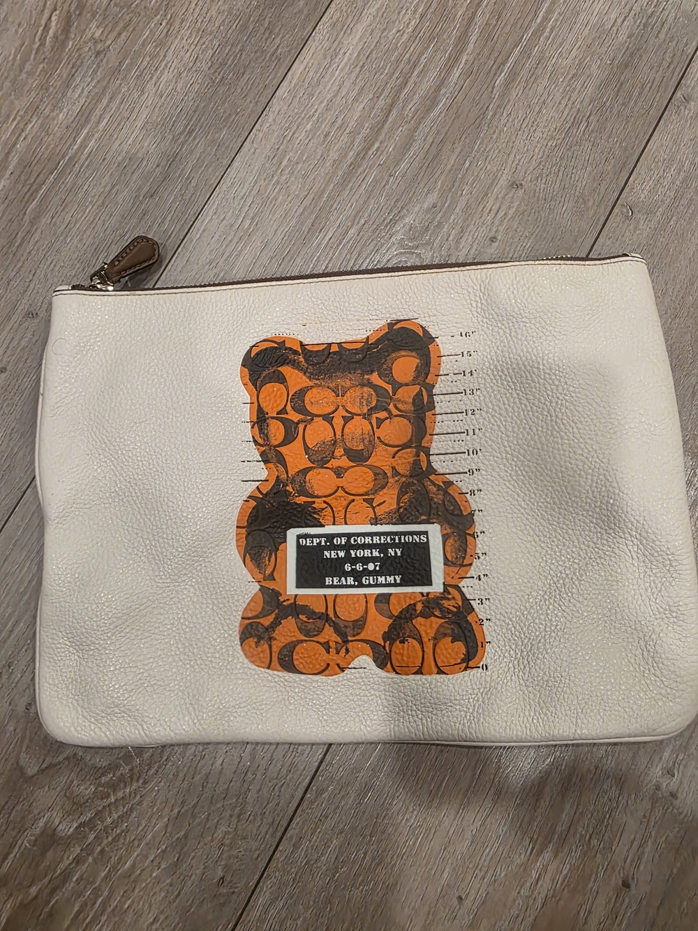 White Leather Pouch with Orange Gummy Bear Graphic